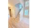 Foyer with hardwood floors, staircase, and plenty of natural light at 3871 Portland Trail Dr, Suwanee, GA 30024