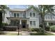 Charming two-story home with a covered front porch, manicured landscaping, and light blue wood siding at 3871 Portland Trail Dr, Suwanee, GA 30024