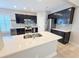 Stylish kitchen featuring an island, stainless steel appliances, and dark cabinetry at 3871 Portland Trail Dr, Suwanee, GA 30024