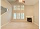Living room with fireplace and large windows at 3871 Portland Trail Dr, Suwanee, GA 30024