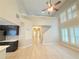 Bright living room with hardwood floors, high ceilings, and plantation shutters, creating an inviting, open space at 3871 Portland Trail Dr, Suwanee, GA 30024