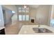Open-concept living room with fireplace, hardwood floors, and ample natural light at 3871 Portland Trail Dr, Suwanee, GA 30024