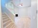 Bright living room with fireplace, stairs and hardwood floors at 3871 Portland Trail Dr, Suwanee, GA 30024