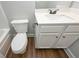 Bathroom featuring a toilet and vanity with a white countertop and dark hardware at 6005 Crowley Dr, Douglasville, GA 30135
