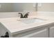 Bathroom vanity with a white countertop, a modern faucet, and undermount sink at 6005 Crowley Dr, Douglasville, GA 30135