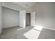 Bright bedroom features neutral paint, plush carpet, and closet with shelving at 6005 Crowley Dr, Douglasville, GA 30135