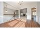 Elegant foyer with hardwood floors, complemented by a staircase with wooden handrail at 6005 Crowley Dr, Douglasville, GA 30135