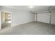 Clean, spacious garage with concrete flooring and an automatic door at 6005 Crowley Dr, Douglasville, GA 30135