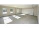 Spacious two-car garage with natural light from three windows and an automatic door at 6005 Crowley Dr, Douglasville, GA 30135