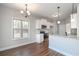 Modern kitchen features white cabinets, stainless steel appliances, and hardwood floors at 6005 Crowley Dr, Douglasville, GA 30135