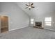 Spacious living room with a fireplace, ceiling fan and two large windows at 6005 Crowley Dr, Douglasville, GA 30135