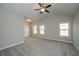 Spacious main bedroom with vaulted ceilings, carpet flooring, and multiple windows for natural light at 6005 Crowley Dr, Douglasville, GA 30135