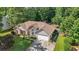 Aerial view of the house showcasing its roof, landscaping, and surrounding trees at 625 Chaseridge Dr, Mcdonough, GA 30253