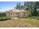 A backyard view with a small patio and lots of natural light shining through multiple windows and doors at 625 Chaseridge Dr, Mcdonough, GA 30253