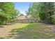 A spacious backyard features a home with a chain link fence, and ample space for outdoor activities at 625 Chaseridge Dr, Mcdonough, GA 30253