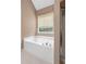 Bathroom featuring a large soaking tub and separate glass-enclosed shower at 625 Chaseridge Dr, Mcdonough, GA 30253