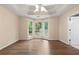 Expansive bedroom with tray ceiling, modern lighting, and bay windows overlooking backyard at 625 Chaseridge Dr, Mcdonough, GA 30253