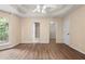 Spacious bedroom featuring tray ceilings, wood-look floors, and ample natural light at 625 Chaseridge Dr, Mcdonough, GA 30253