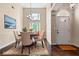 Elegant dining room with high ceilings, modern chandelier, and ample natural light at 625 Chaseridge Dr, Mcdonough, GA 30253