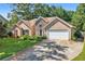 Charming two-story home with stone accents, well-maintained lawn, and a two-car garage at 625 Chaseridge Dr, Mcdonough, GA 30253
