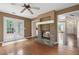 Cozy living room with stone fireplace and hardwood floors, filled with natural light at 625 Chaseridge Dr, Mcdonough, GA 30253