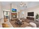 Inviting living room with a stone fireplace, cozy furniture and plenty of room for activities at 625 Chaseridge Dr, Mcdonough, GA 30253