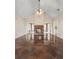 Open living room featuring a stone fireplace and sleek stained concrete floors at 625 Chaseridge Dr, Mcdonough, GA 30253