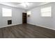 Spacious bedroom with hardwood floors, lots of natural light, and simple furnishing at 1112 Mealor Rd, Lawrenceville, GA 30043