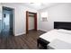 Bedroom features hardwood floors, large closet, neutral walls and access to bathroom at 1112 Mealor Rd, Lawrenceville, GA 30043