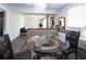 Dining area with updated flooring, a glass-top table, and an open view of the living room at 1112 Mealor Rd, Lawrenceville, GA 30043