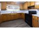Well-equipped kitchen boasting ample counter space, wood cabinetry, and new flooring at 1112 Mealor Rd, Lawrenceville, GA 30043