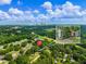 Aerial view shows the house with a red pin on top, trees, and skyline view at 1560 Pontiac Se Pl, Atlanta, GA 30315