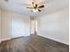 Bedroom features include wood flooring, a ceiling fan, and a closet for optimal storage at 1560 Pontiac Se Pl, Atlanta, GA 30315