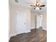 Bedroom features include wood flooring, a ceiling fan, and a closet for optimal storage at 1560 Pontiac Se Pl, Atlanta, GA 30315