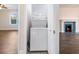 Conveniently located laundry room with a stacked washer and dryer setup at 1560 Pontiac Se Pl, Atlanta, GA 30315