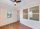 Enclosed sun room featuring ample natural light, new floors, and a ceiling fan at 1560 Pontiac Se Pl, Atlanta, GA 30315