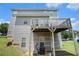 A view of the back exterior highlighting the home's elevated deck feature at 201 Providence Dr, Dallas, GA 30157