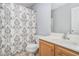 Full bathroom with a single sink vanity and a patterned shower curtain at 201 Providence Dr, Dallas, GA 30157