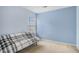 Comfortable bedroom with blue walls, carpet and space for relaxing at 201 Providence Dr, Dallas, GA 30157