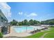 Large community pool area with lounge chairs and shade coverings at 201 Providence Dr, Dallas, GA 30157