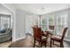 Bright dining room with hardwood floors, a glass table, and views to other rooms at 201 Providence Dr, Dallas, GA 30157