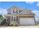 Two-story house with light gray vinyl siding, red shutters, stone facade, and an attached garage at 201 Providence Dr, Dallas, GA 30157