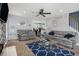 Inviting living room featuring two sofas, a glass coffee table, and a ceiling fan at 201 Providence Dr, Dallas, GA 30157