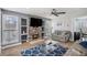 Cozy living room with a stone fireplace, built-in shelving, and stylish decor at 201 Providence Dr, Dallas, GA 30157