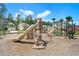 Community playground featuring slides, climbing wall, and playsets for children at 201 Providence Dr, Dallas, GA 30157