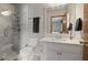 Updated bathroom with a glass-enclosed shower and marble countertop at 3916 S Martin Way, Lithia Springs, GA 30122