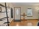 Inviting entryway with hardwood floors, coat hooks, and decorative mirror at 3916 S Martin Way, Lithia Springs, GA 30122