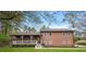 Charming two-story home with covered porch, green lawn and beautiful trees at 3916 S Martin Way, Lithia Springs, GA 30122