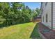 A well-maintained yard with a wooden deck and green space offers a peaceful outdoor retreat at 5740 Zelkova Dr, Cumming, GA 30040