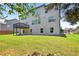 A well-manicured backyard features a walkout deck and a lush lawn offering ample space for outdoor activities at 5740 Zelkova Dr, Cumming, GA 30040